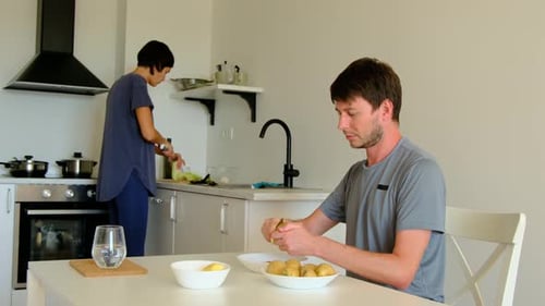 Couple Preparing Food Together in Kitchen