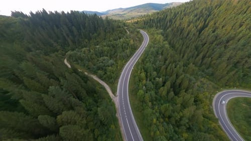 Inspiring Aerial Shot of Beautiful Green Forest Mountain Valley Natural Environment Curvy Highway