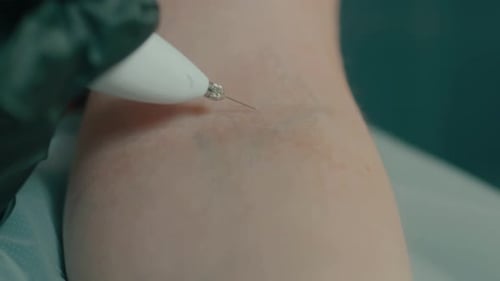 Medical Pen Device Used on Arm Close Up