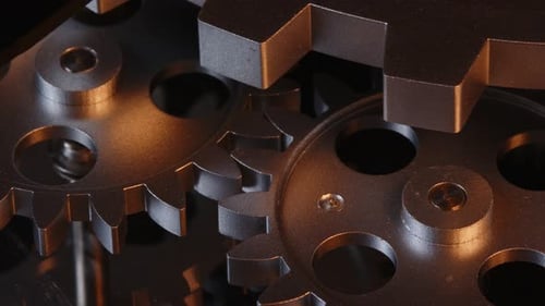 Rotating Silver Gears Close Up