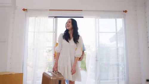 Happy Couple Moving Into New Home With Boxes