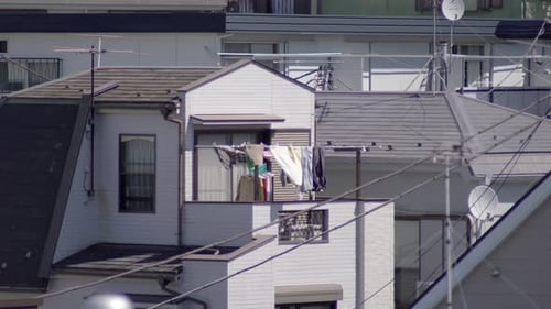 A typical Japanese home, clothes drying in the hot sun on a Sunday - close up