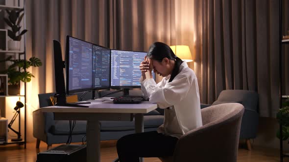 Asian Woman Programmer Having A Headache Creating Software Engineer ...