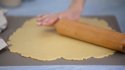 Rolling Dough with Wooden Rolling Pin