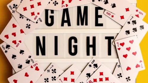 Zoom in Out Game Night Text on Lightbox with Playing Cards on Yellow Background Table Games