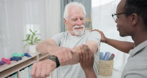 Senior Man Stretching Arm with Assistance