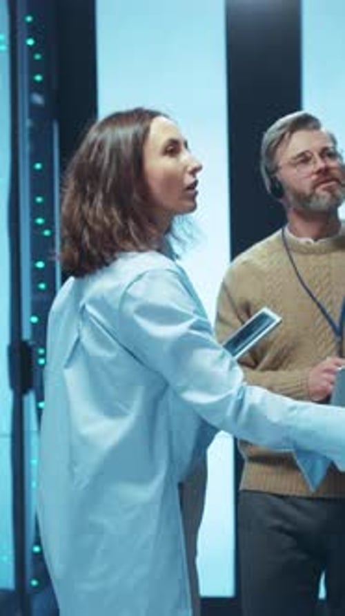 Technology Team Inspecting Servers