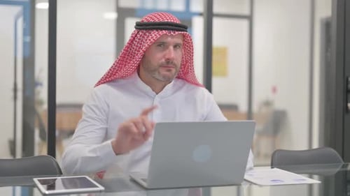 Arabian Man at Desk Denies Request