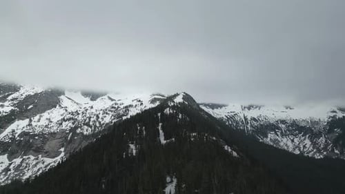Snowy Mountain Peaks and Forest. British Columbia, Canada.