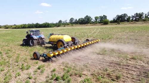 Blue Tractor O.A. Planting Canola On No Till Field