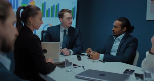 Multiethnic Business Team Discussing Strategy and Tasks at Business Meeting Teamwork Prores