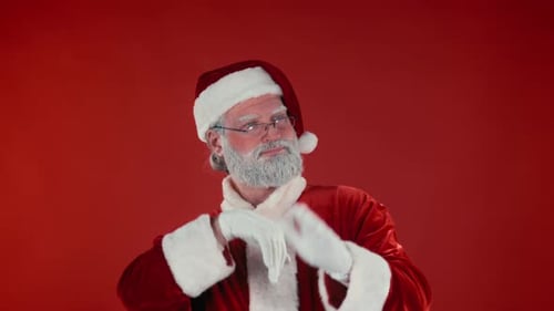 Santa Claus Posing and Gesturing on Red Background
