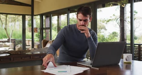 Man Works from Home, Reviews Finances