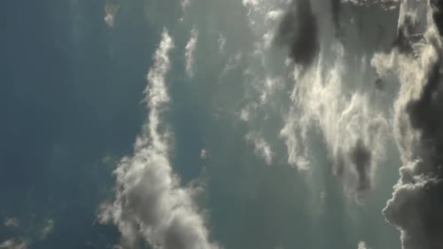 Time lapse of dynamic cloudscape in dramatic sky, vertical video