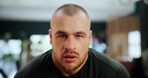 Tough Man Sweating After Workout in Gym