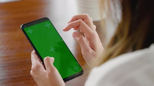 Happy female lifestyle sitting in cafe near window she cellphone on mobile phone