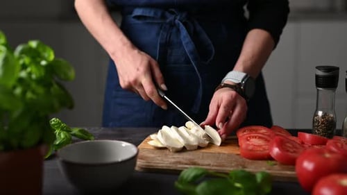 Slicing Mozzarella Cheese for Cooking Preparation