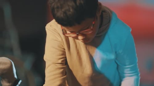 Child and Adult Working on a Wood Project