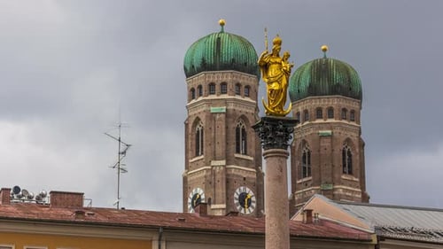 Statue of Saint Mary on Marienplatz with Frauenkirche Towers in a Timelapse