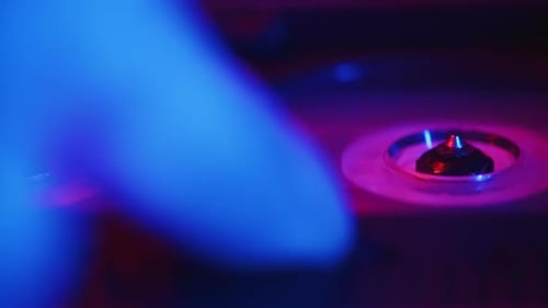 Audio Engineer Puts a Cassette Tape Into a Professional Recorder and Starts the Recording During the