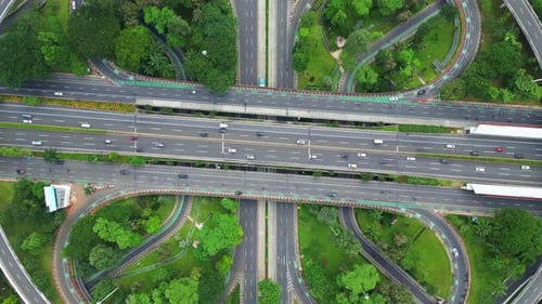 A large highway with a lot of trees and grass