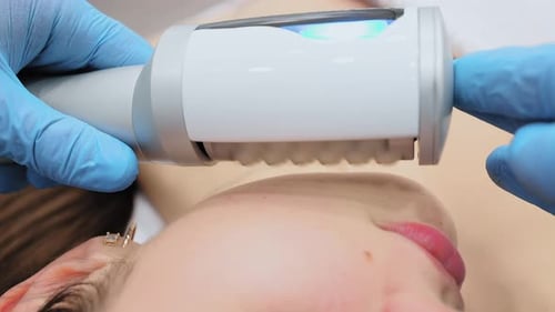 Woman Receiving Cosmetic Facial Treatment