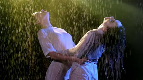 Brunettes Bend and Hold Each Other While Enjoy Bad Weather
