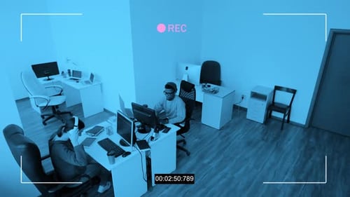 Young People Working In Office Security Camera Shot