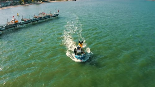 Aerial view of fishing boat on the blue waters of baltic sea