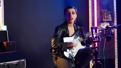 Woman Plays Electric Guitar During Online Streaming Session