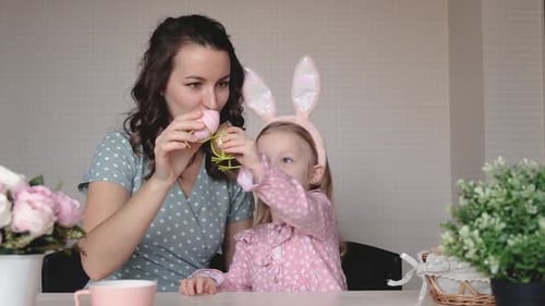Mother and Daughter Decorating Easter Eggs