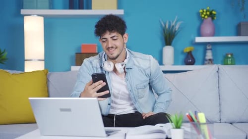 Young Adult on Video Call with Laptop