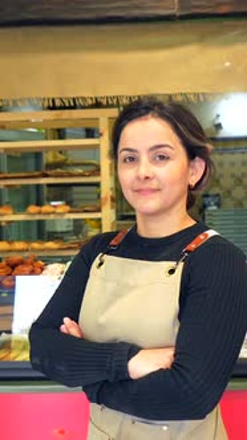 Confident Woman Worker Standing Proud in a Bakery Shop