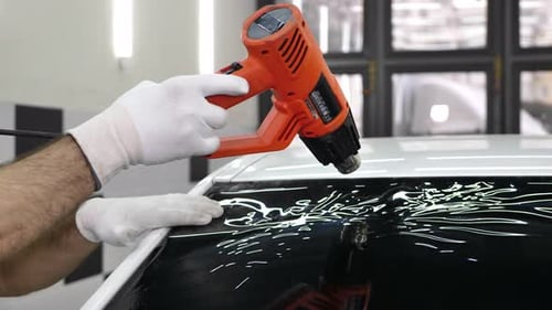 Professional Applying Tint Film to Car Window