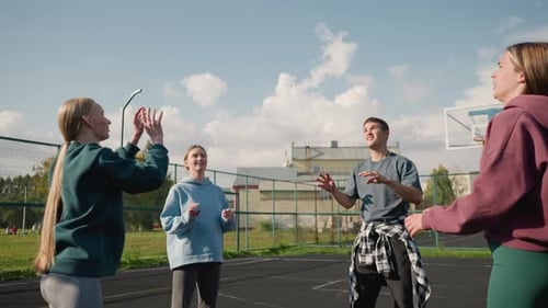 Training Session with Three Ladies Playing Volleyball and Coach in Outdoor Court