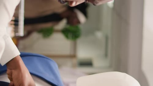 Man Dressing Mannequin With Blue Suit