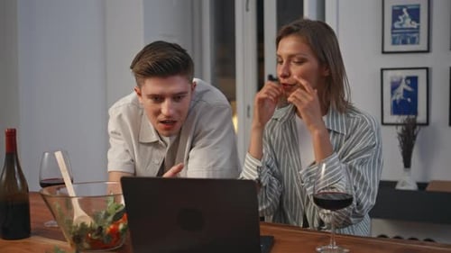 Young Couple Talking on Laptop at Home
