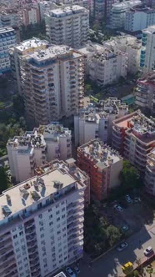 Vertical Video of a City Along the Coastline With the Mediterranean Sea Sparkling in the Background