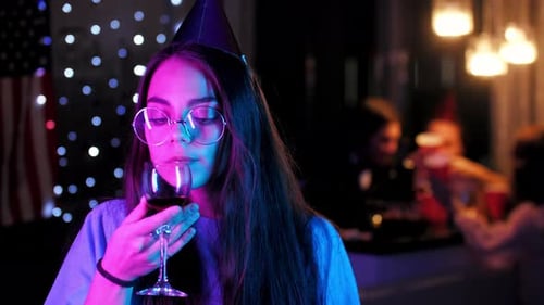 Woman Celebrates Birthday with Wine, Party