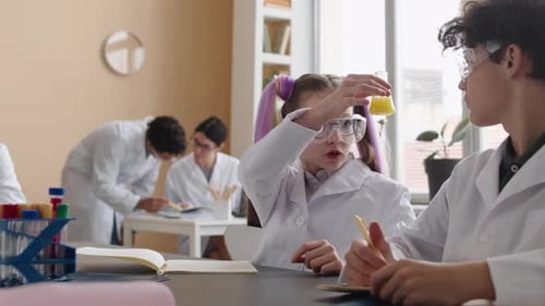 Young Students Conducting Science Experiments in Classroom