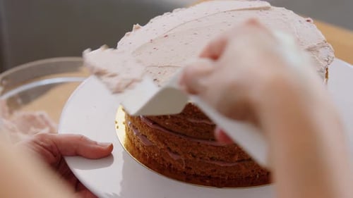 Culinary, Baking and Cooking Food Concept - Woman Making Layer Cake And