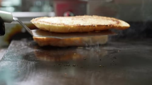 Toasted Bread Slices Cooking on Restaurant Grill