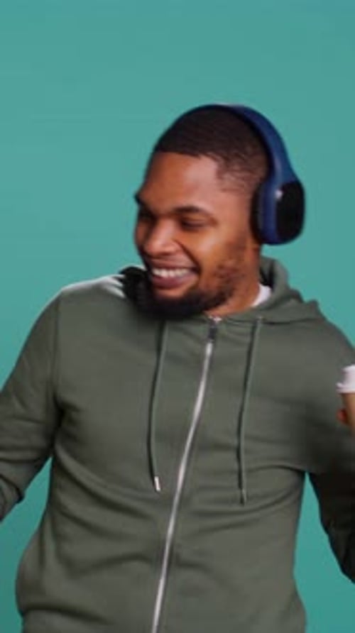 Man Dancing with Coffee and Headphones