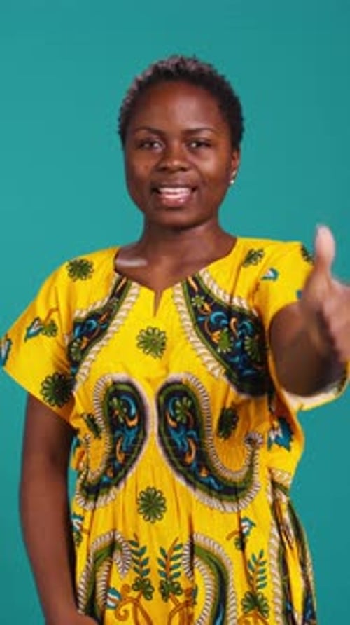 Vertical Video Cheerful Positive Woman Showing Thumbs Up Gesture in Studio