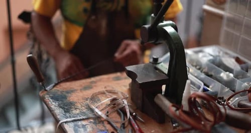 Craftsman Making New Leather Belts at the Local Market Adult
