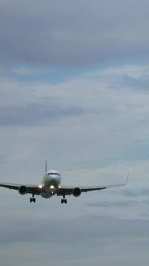 Airplane Preparing to Land on a Cloudy Day