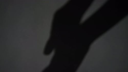 Hand Silhouettes Reach in Abstract Movement