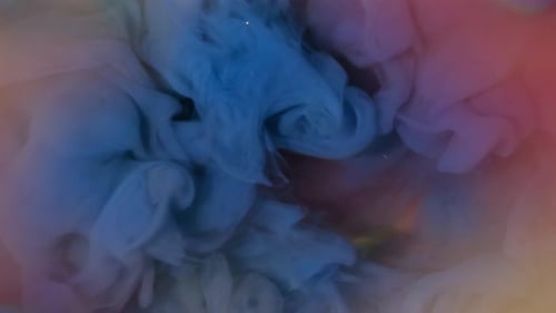 Abstract Blue Ink Cloud Mixing in Colorful Water