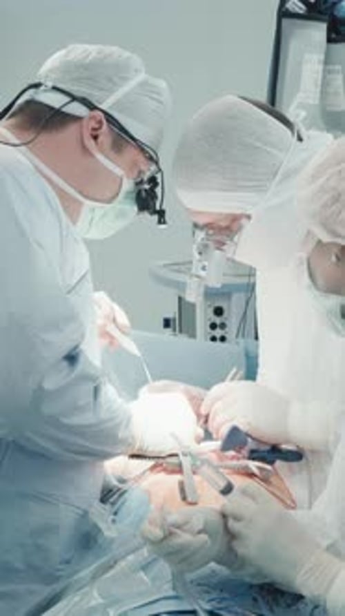 Surgeons Perform Operation in Brightly Lit Operating Room
