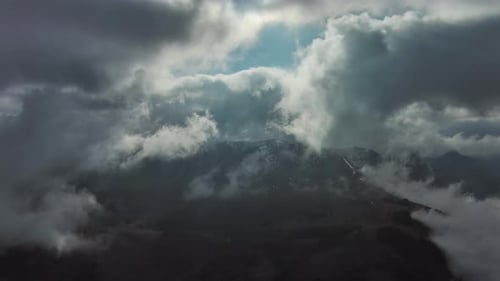 Aerial High View of Dramatic Clouds Flying